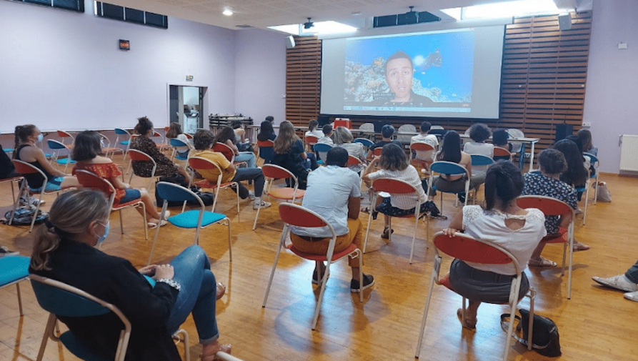 A classroom watching a video.
