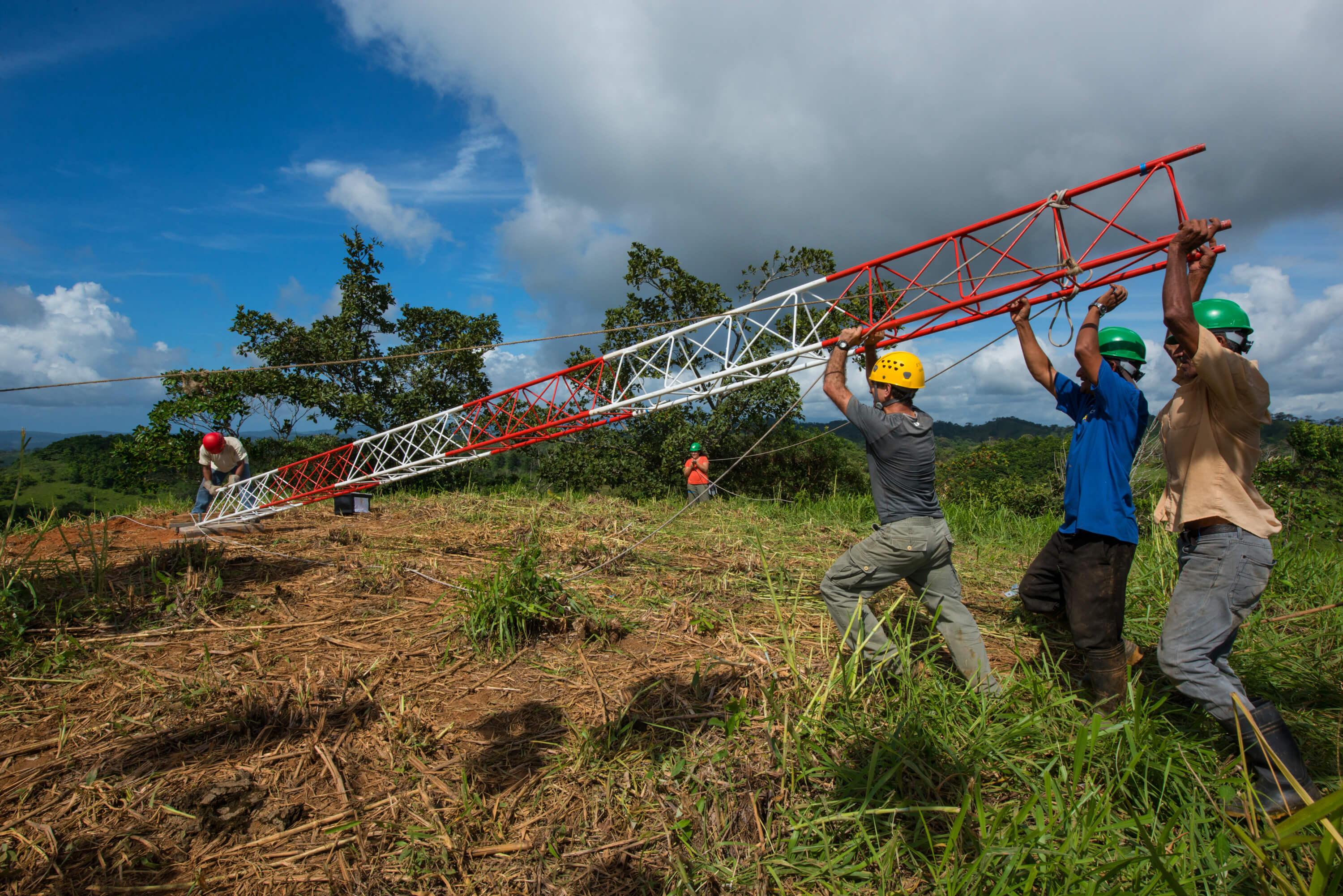 Technicians from the STRI Physical Monitoring Program install a meteorological tower. Two strategically located meteorological stations were made possible with support from the Heising-Simons Foundation. Photo credit Jorge Aleman.