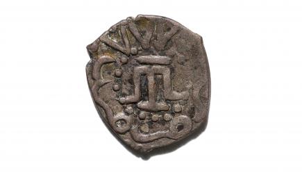 An akce coin from 1483-1484, of the Crimean Khanate depicting a variant of the tarak tamga emblem of the Crimean Tatar people.