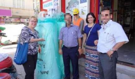 Conservationists standing next to emergency packing supplies