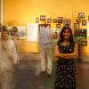 Head curator for Beyond Bollywood posing with exhibition