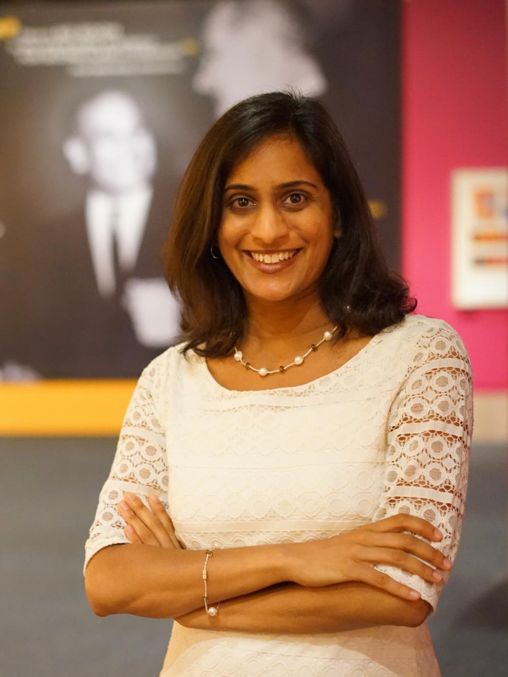 Curator Masum Momaya in the "Beyond Bollywood: Indian Americans Shape the Nation" exhibition at the National Museum of Natural History, August 2015. Photograph by Shan Jalla. Photo Credit Smithsonian Asian Pacific American Center