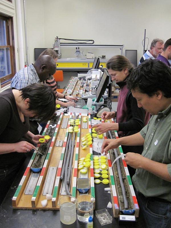 Twenty-two researchers from around the world participated in the Olorgesailie core workshop. The team collected samples every 48 centimeters in order to carry out many different kinds of environmental analysis. Photo credit: Smithsonian Institution.